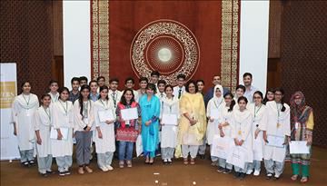 Mariam Sajjad receives the First Position Award from AKU-EB